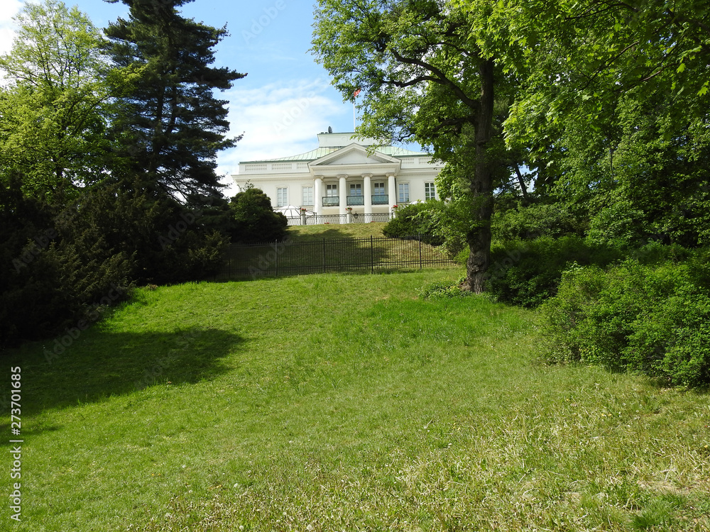 The white villa on the green hill