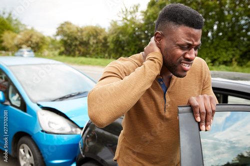 Konstfotografi Male Motorist With Whiplash Injury In Car Crash Getting Out Of Vehicle
