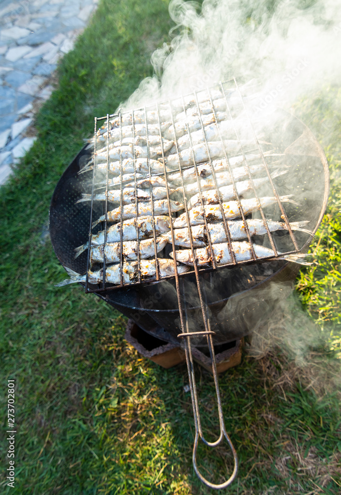 Grilled sardines on the grill