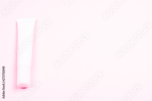 Wallpaper Mural Pink cosmetic tube on background of the same tone. Torontodigital.ca