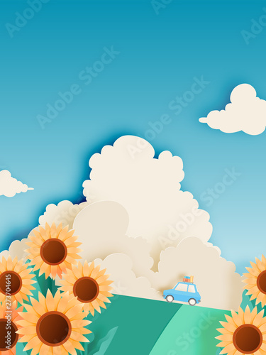 Sunflower field with road trip car