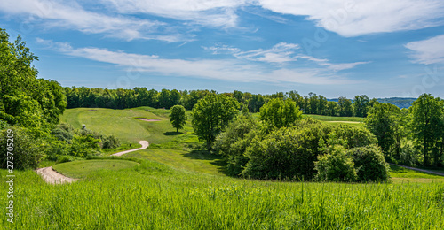 rolling hills of golf course on a bright sunny day