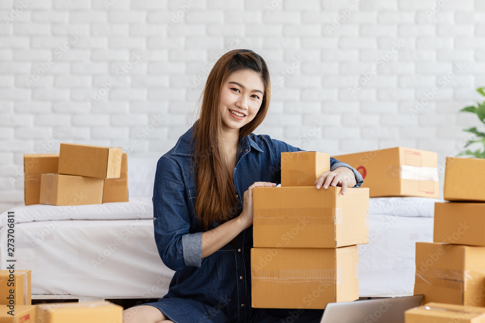 SME entrepreneur of Young Asian women working with laptop for Online shopping at home,Cheerful and Happy with box for packaging in home,Own Business Start up for Business Online and Online shopping SME entrepreneur of Young Asian women working with laptop for Online shopping at home,Cheerful and Happy with box for packaging in home,Own Business Start up for Business Online and Online shopping