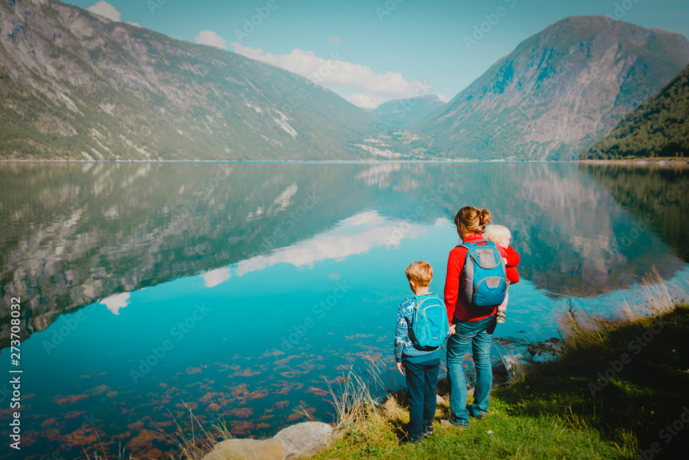 family travel concept- mother with kids travel in nature