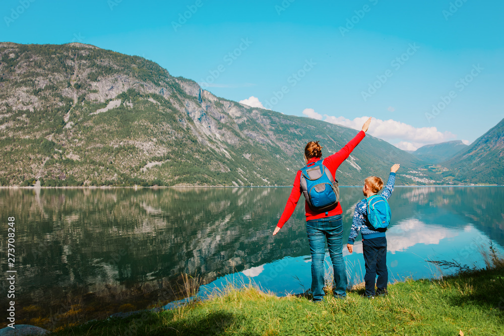 family travel concept- mother and son travel in nature