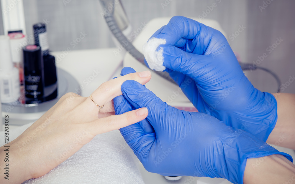 Finger nail treatment, grinding and polishing in beauty salon Finger nail treatment, grinding and polishing in beauty salon