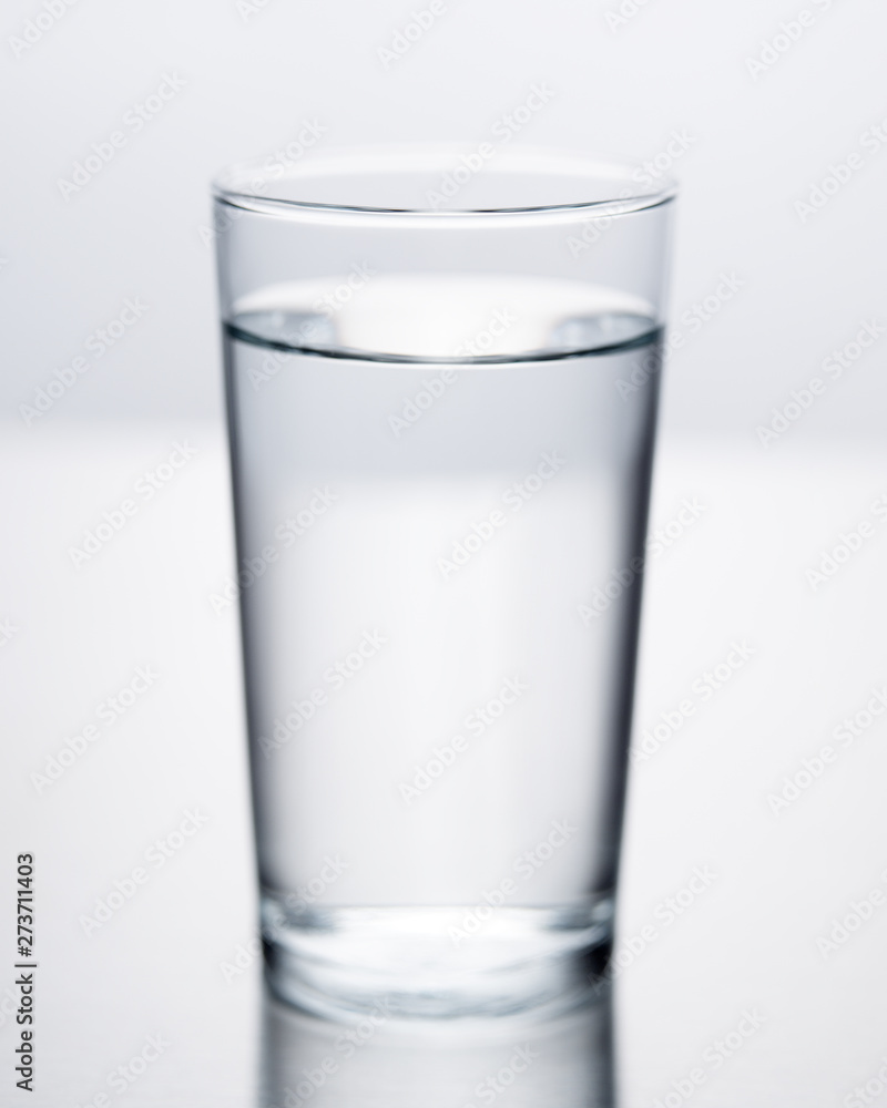 Single selective focus water glass with pure clean water Single selective focus water glass with pure clean water