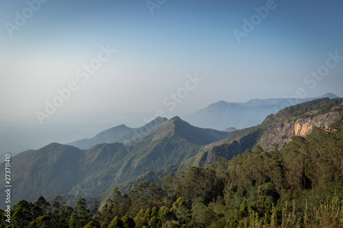 Hill top with leading hills and blue sky