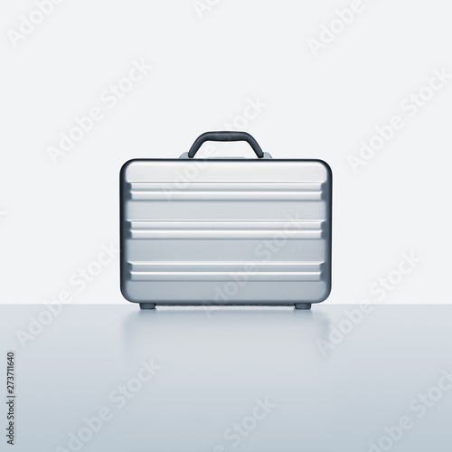 Contemporary aluminum briefcase on blue grey with subtle reflection