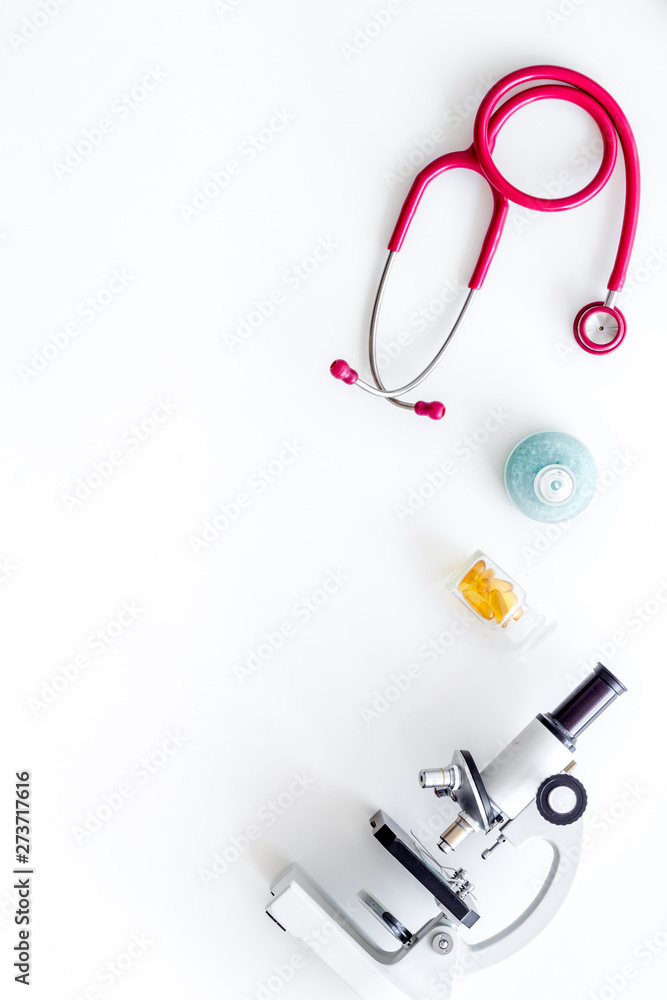 Do medical research with microscope, stethoscope, test-tubes in lab on white background top view mock-up Do medical research with microscope, stethoscope, test-tubes in lab on white background top view mock-up