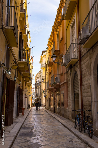 Fototapeta Naklejka Na Ścianę i Meble -  Typical picturesque narrow street in the Old Town of Bari, Puglia region, Southern Italy.