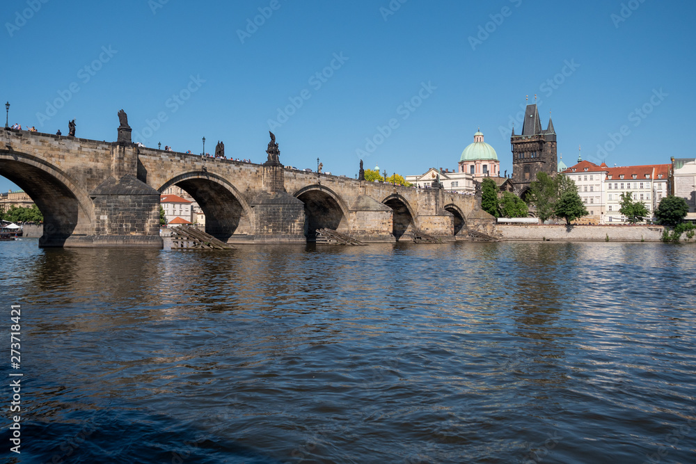 Charles Bridge across River Vltava and Old Town Bridge Tower in Prague, Bohemia, Czech Republic. Called Karluv Most in Czech.