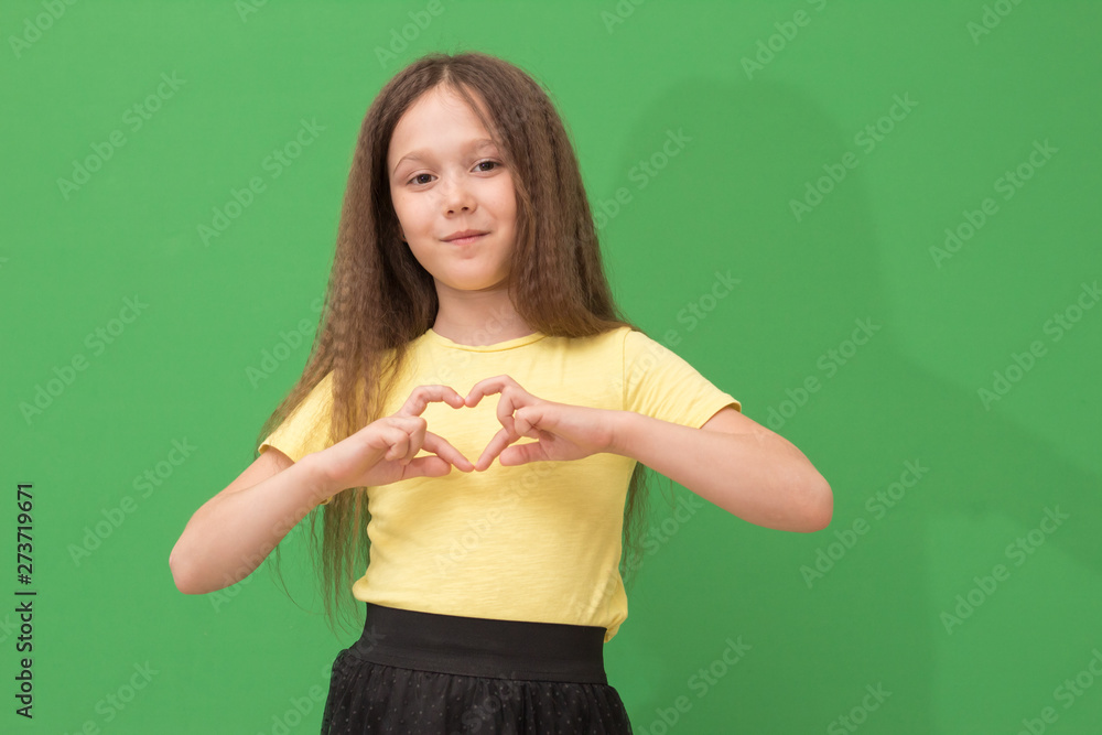 child shows the heart with his hands child shows the heart with his hands