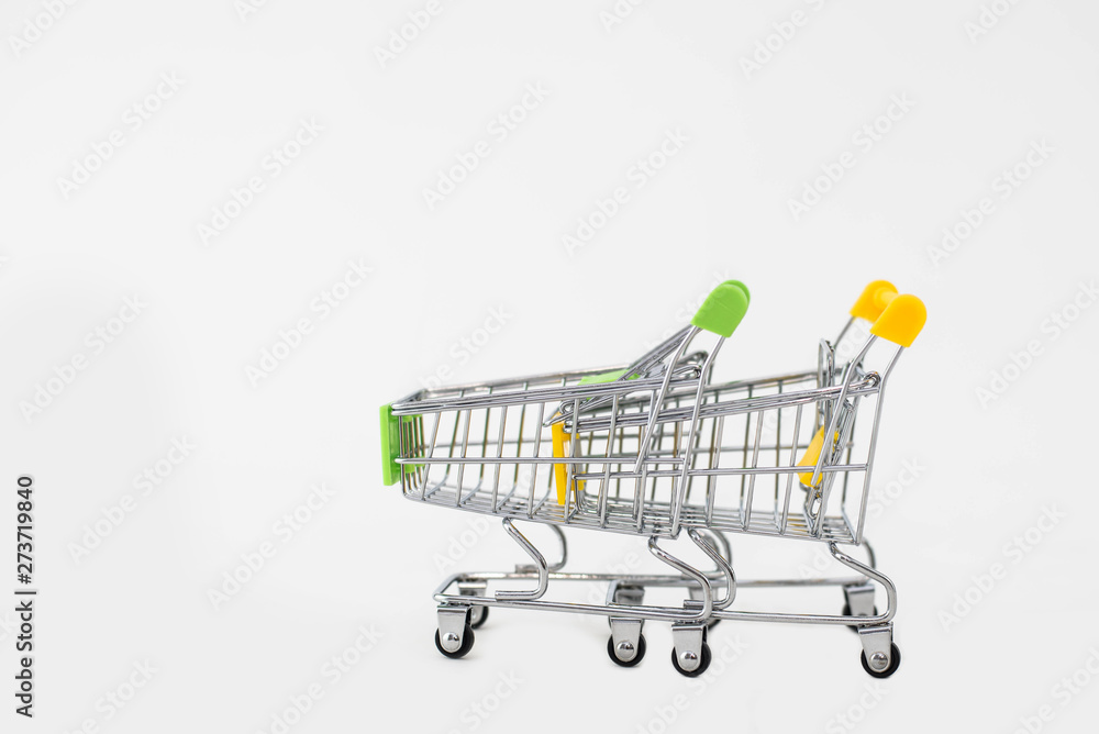small shopping carts on white background small shopping carts on white background