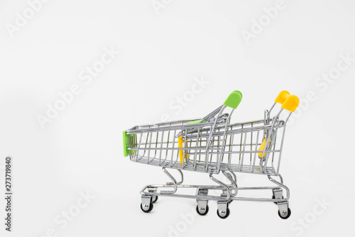 small shopping carts on white background © MartaKlos