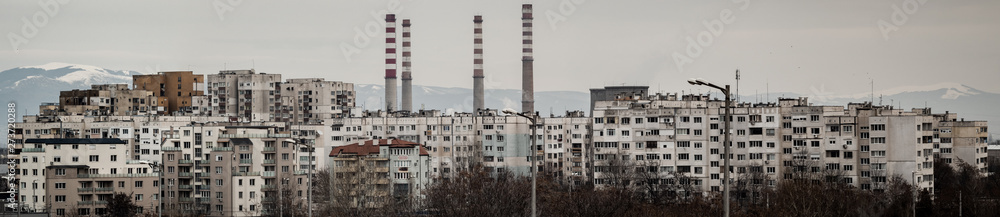 Panorama of concrete blocks and a power plant