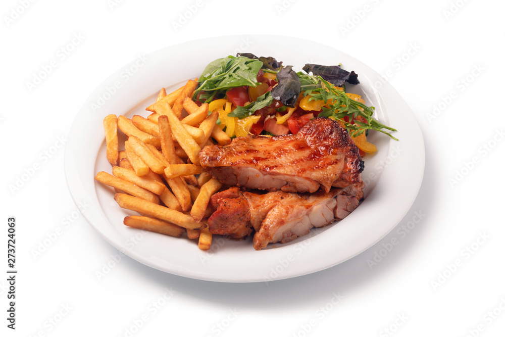 Chicken schnitzel, served with fries and salad on a plate, isolated on white background Chicken schnitzel, served with fries and salad on a plate, isolated on white background