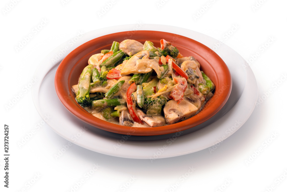 Stewed meat with vegetables and mushrooms in sour cream sauce, isolated on white background Stewed meat with vegetables and mushrooms in sour cream sauce, isolated on white background