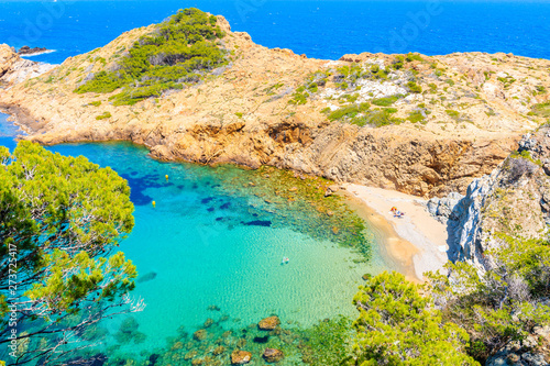 Boats in beautiful sea bay with beach near Sa Tuna village, Costa Brava, Spain