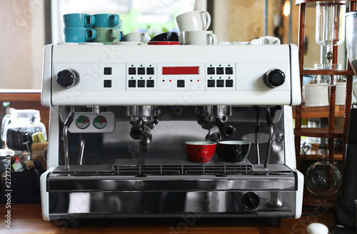 Modern coffee machine on bar counter in cafe