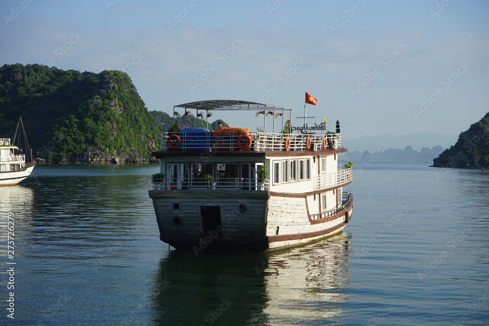 VIETNAM HANOI Halong Bay 2019 YEAR, Beautiful scenic view on a foggy cloudy day of the cruises in Halong Bay. It is a beautiful natural wonder in northern Vietnam near the Chinese border, on VIETNAM HANOI Halong Bay 2019 YEAR, Beautiful scenic view on a foggy cloudy day of the cruises in Halong Bay. It is a beautiful natural wonder in northern Vietnam near the Chinese border, on