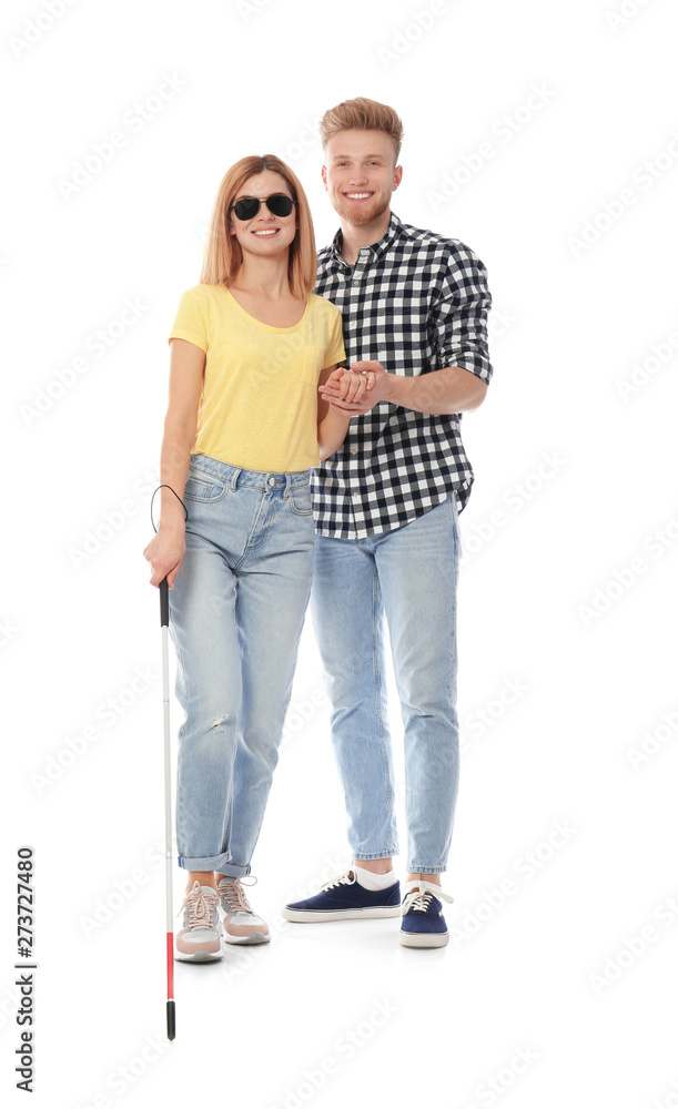 Young man helping blind person with long cane on white background Young man helping blind person with long cane on white background