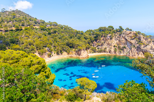 Boats in Cala Giverola, most beautiful beach on Costa Brava, Spain