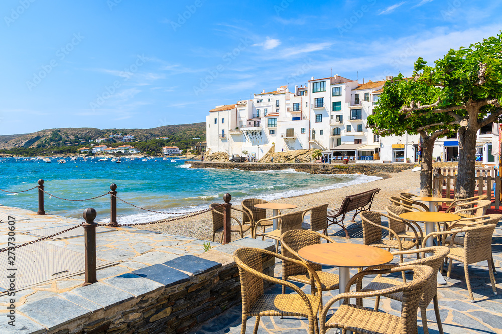 Restaurant tables along sea in Cadaques village, Costa Brava, Spain Restaurant tables along sea in Cadaques village, Costa Brava, Spain