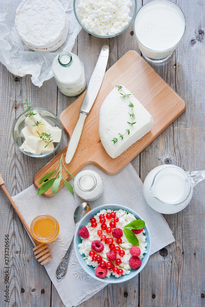 Natural dairy products on a light gray wooden background Natural dairy products on a light gray wooden background