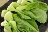 Close up of freshly rinsed bok choy leaves