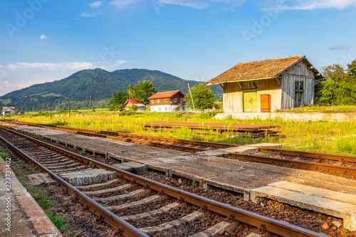 Wallpaper Mural Railroad tracks and old wooden building at the abandoned railway station Cornet at Tutulesti, Romania, Valcea County Torontodigital.ca