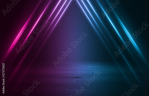 Empty background scene. Dark street reflection on wet asphalt. Rays of neon light in the dark, neon figures, smoke. Background of empty stage show. Abstract dark background.