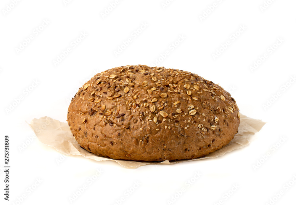 Baked bread on a white background. Homemade bread close up. Baked bread on a white background. Homemade bread close up.