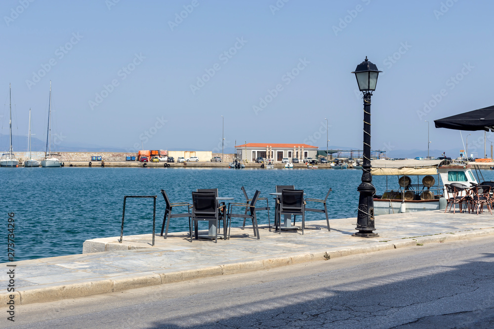 Tables and chairs of a street cafe (Greece, Peloponnese)