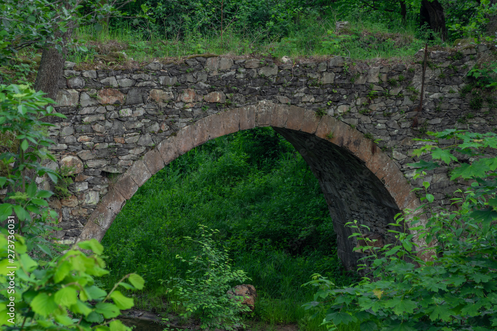 Aqueduct over river Kamenice in national park in spring evening