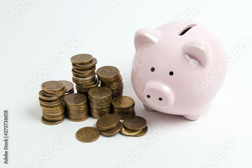 piggy bank with coin on white background