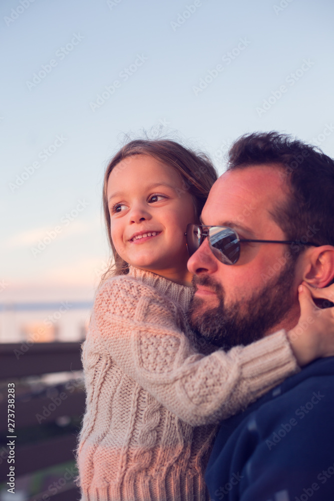 Father and daughter share a loving, affectionate moment. Father and daughter share a loving, affectionate moment.