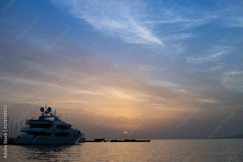 boat on sea at sunset