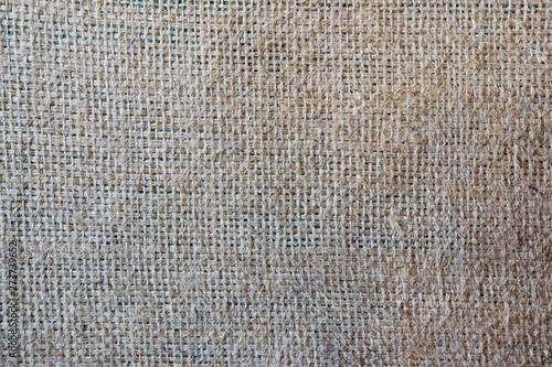 Gray sackcloth on a green backdrop. Texture background. photo