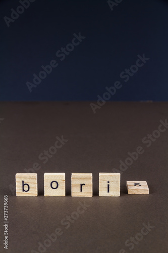 Childrens letter blocks spelling Boris with S fallen, portrait photo