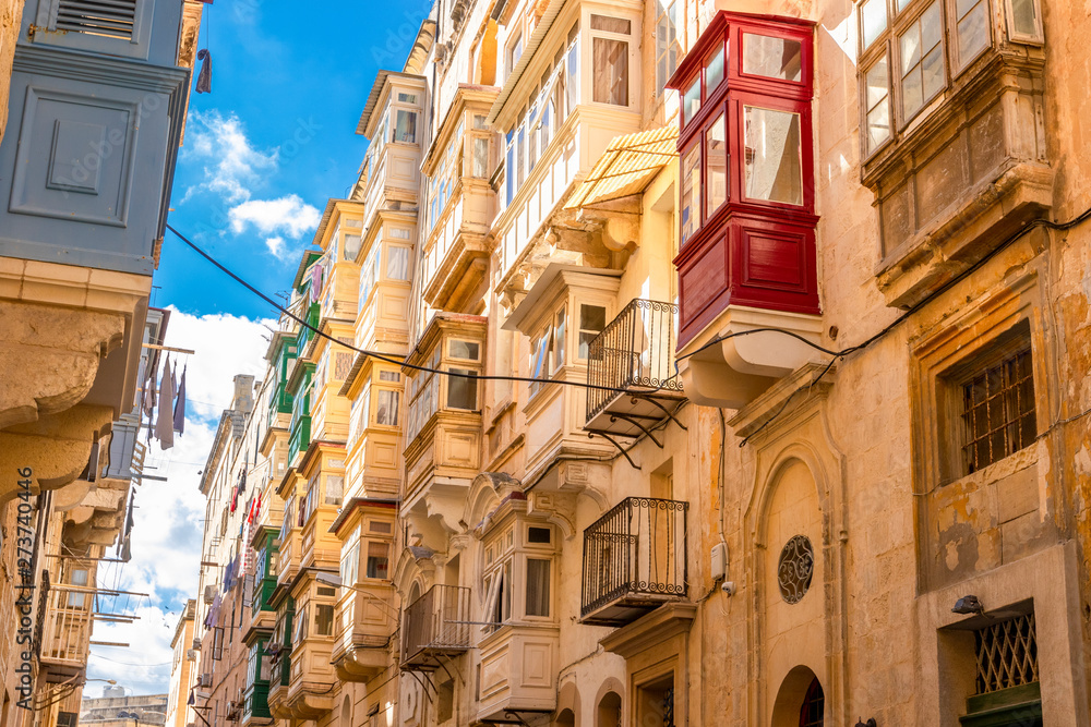 Maltese streets and colorful wooden balconies in Valletta, Malta