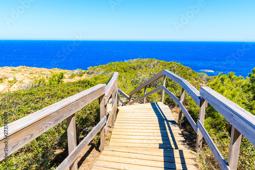 Coastal wooden walkway to sea near Sa Tuna village, Costa Brava, Spain