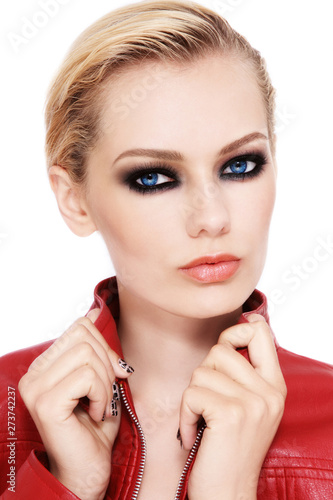 Portrait of young beautiful blonde woman with fancy smoky eye makeup