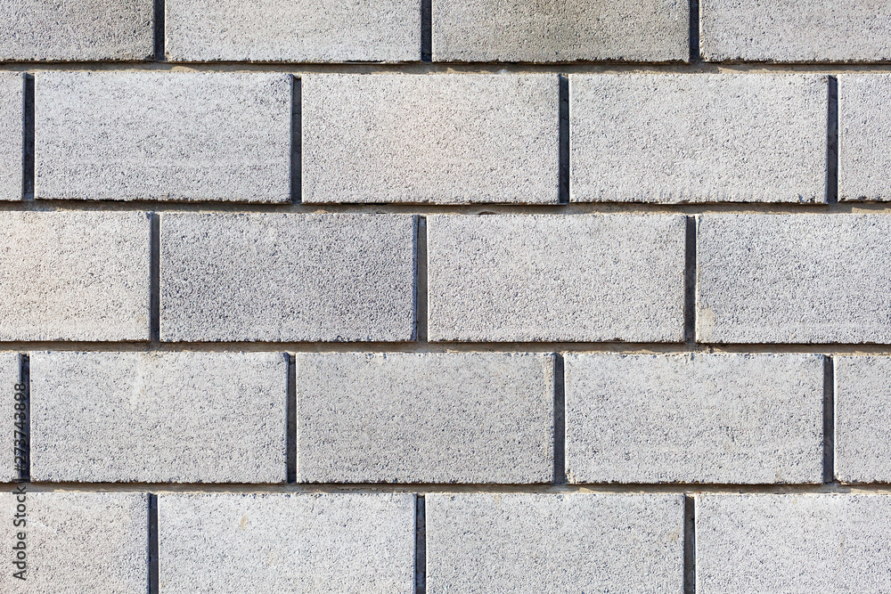 Gray bricks, wall made of large gray blocks. Gray background Gray bricks, wall made of large gray blocks. Gray background