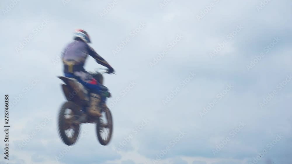 Motocross riders overcome the jump in slow motion. Jumping on a springboard.1920X1080 Full Hd. Motocross riders overcome the jump in slow motion. Jumping on a springboard.1920X1080 Full Hd.