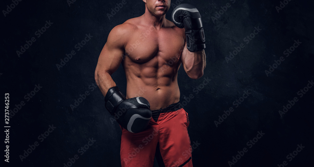 Man with beautifully muscular body is ready for fight, swowing his spectacular hits.