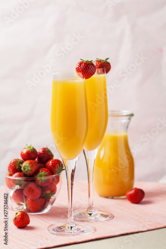 Mimosa cocktail and strawberries