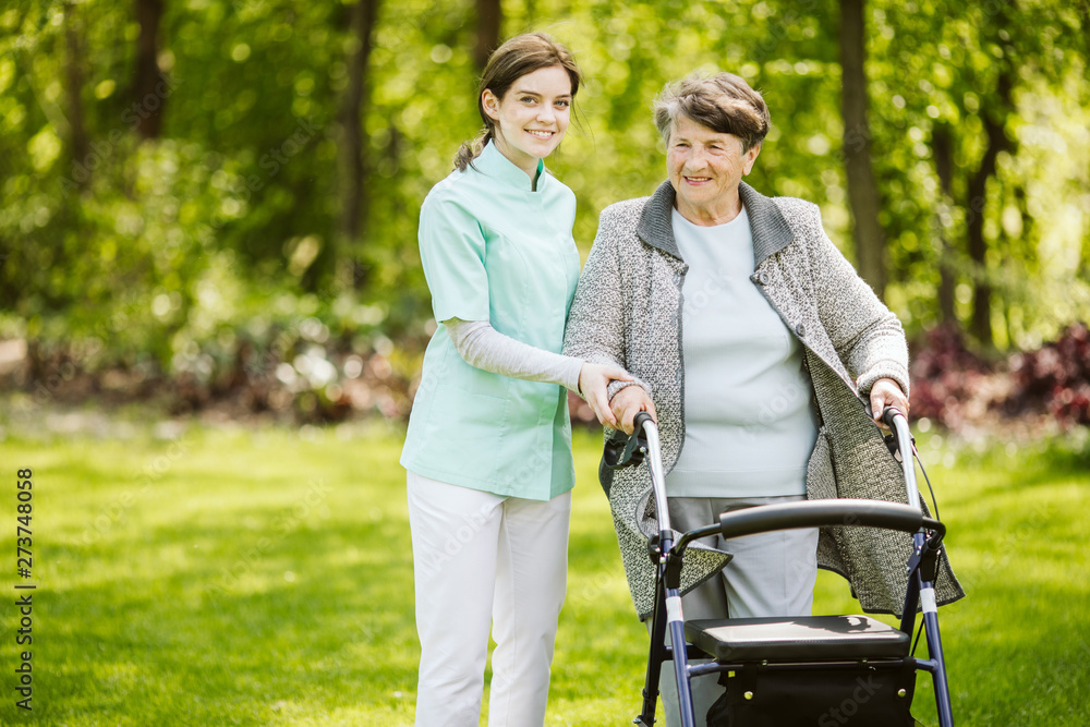 Young female trainee with patient in the nursing home Young female trainee with patient in the nursing home