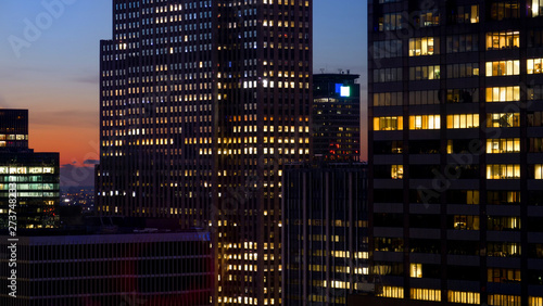 CLOSE UP: Spectacular shot of skyscrapers in New York lighting up at sunset.