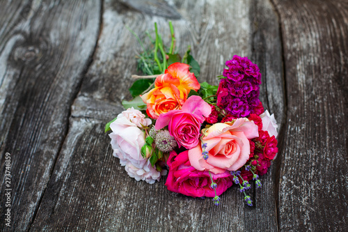boquet of roses on old wooden surface